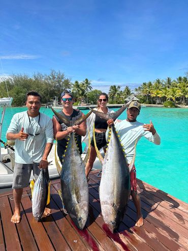 Happy Guests after a great day of fishing in Bora Bora. Two big yellowfin tunas