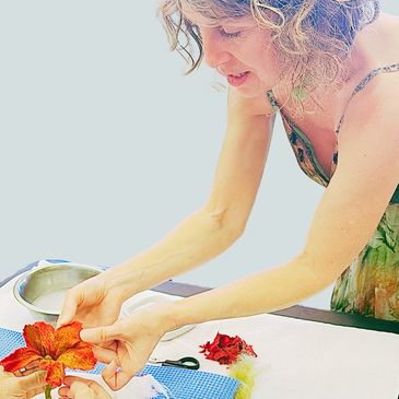 Instructor helping a student making a felted flower