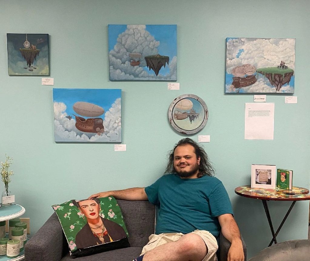 Bryce Cloutier shown with his work - art class sub, volunteer