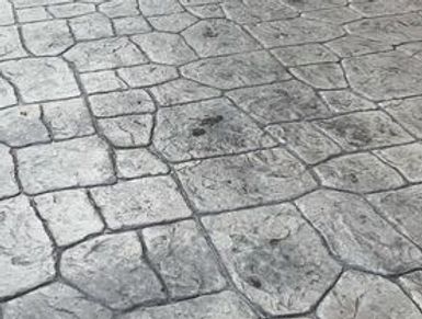 Stamped concrete with irregular stone pattern.
