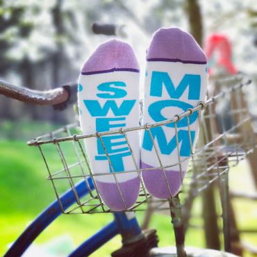 Sweet Mom socks in a bicycle basket