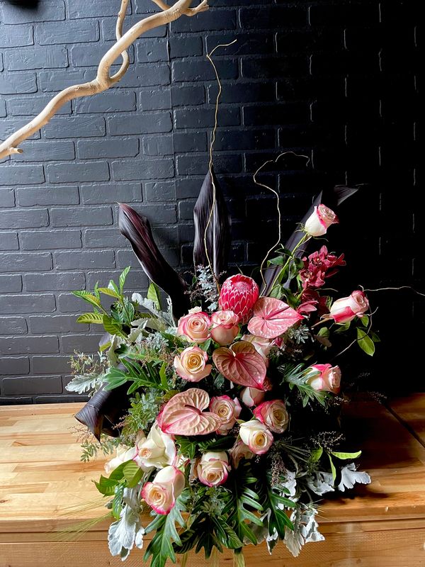 funeral flowers, tropical flowers, protea, black and pink flowers