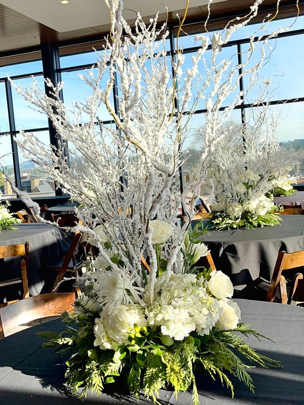 flocked branches in white centerpieces fresh flowers, hydrangeas and roses for Christmas event