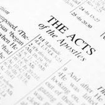 Close-up of a Bible page showing "The Acts of the Apostles."