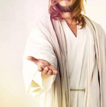 Person in white robe extending hand forward.