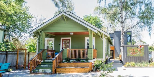 Cute green bungalow used as a vacation rental home in Portland, Oregon.