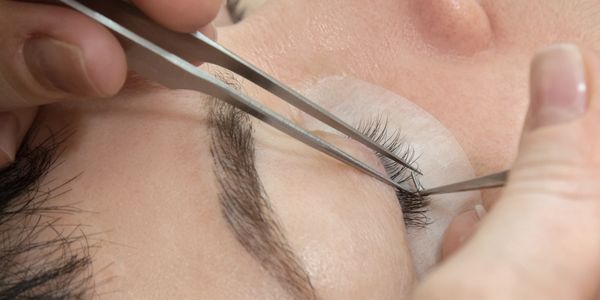 a woman having eyebrow treatment