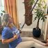 Seated pull-down for upper body stretch, corrects posture on Fit5 Solution’s Posture Station