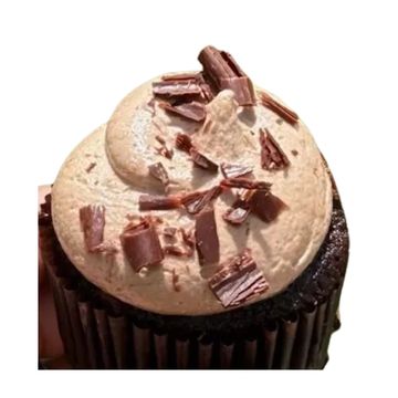 Chocolate cupcake with creamy frosting and chocolate shavings.