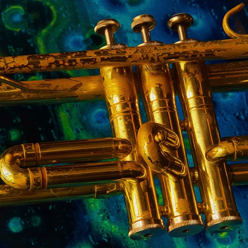 Close-up of a trumpets valves and slides with a blue and green light painted image of a fermentation