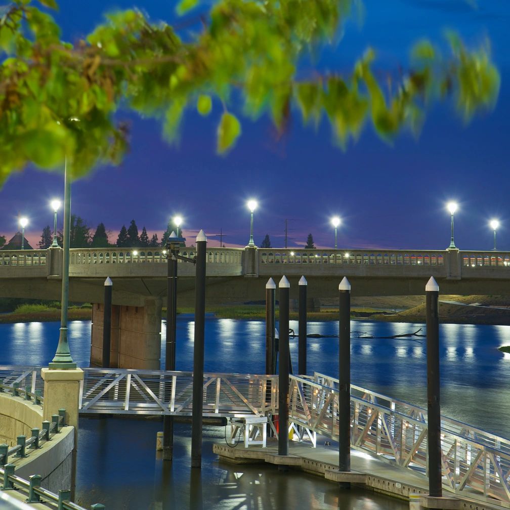 Napa Riverfront at Twilight,  Intense colors in the sky & water, the bridge & rustling leaves