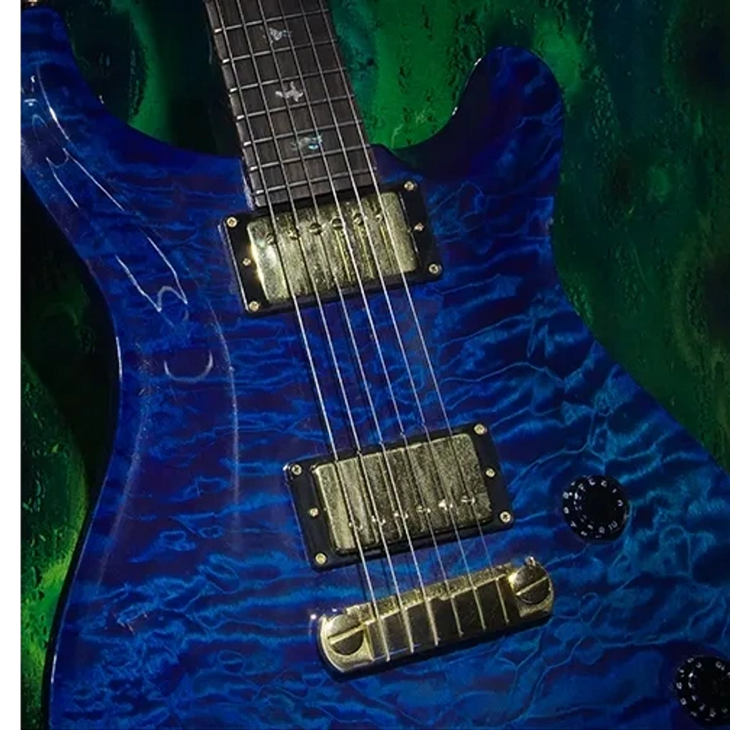 This is an image of an Electric Blue, Electric Guitar with a green background