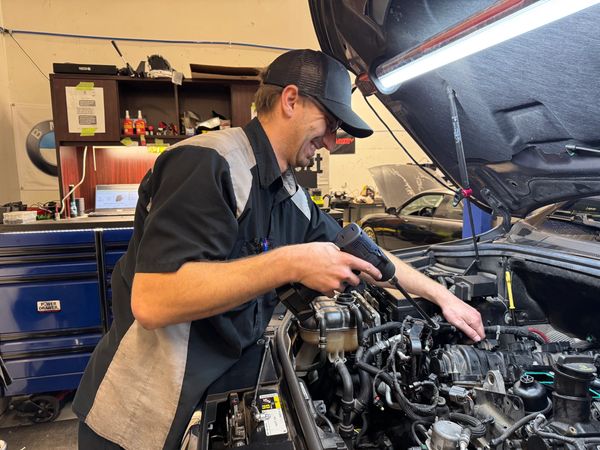 Chase working on a Jeep Grand Cherokee