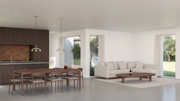 Modern open-plan kitchen and living area with wooden furniture.