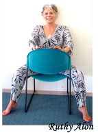 Ruthy Alon seated in a chair
