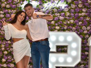 A man and a woman celebrating a birthday