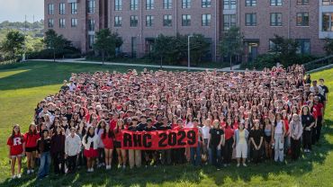 Large group photo of Rutgers University class of 2029 holding a banner.