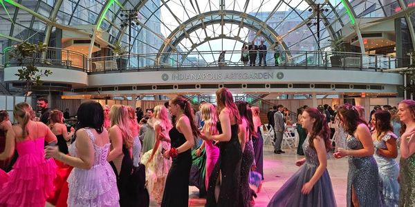 People dancing in formal attire at Indianapolis Artsgarden.