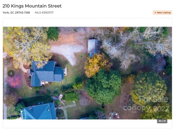 Aerial photograph. Drone photograph is poorly framed. Use drones properly for MLS listing photos.