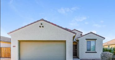 Modern suburban house with a two-car garage.