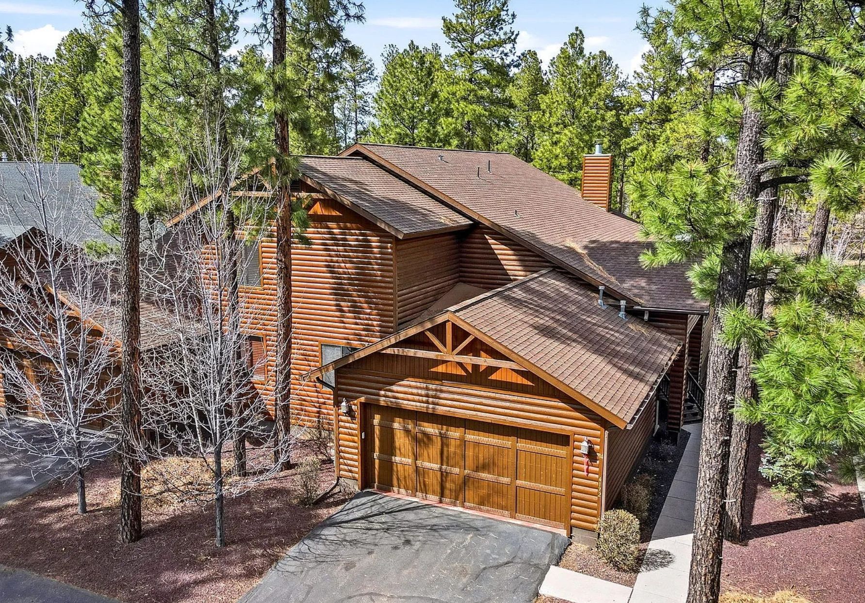 Log cabin among tall pines in Pinetop, Arizona