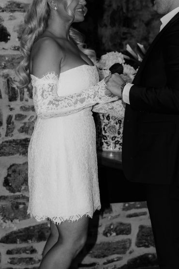 Bride and groom holding hands during wedding ceremony.