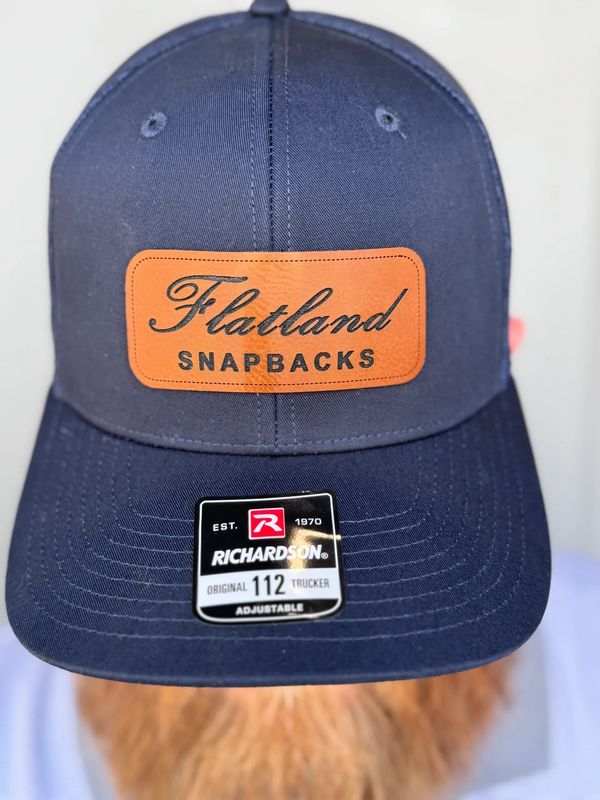 "The Classic Script" featured on a navy Richardson 112.