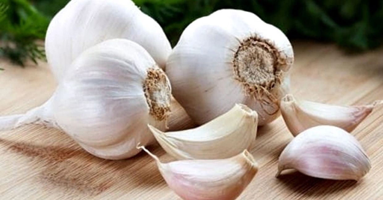 Cloves of garlic - containing the antiviral phytochemical Allicin - a popular spice used in dishes.