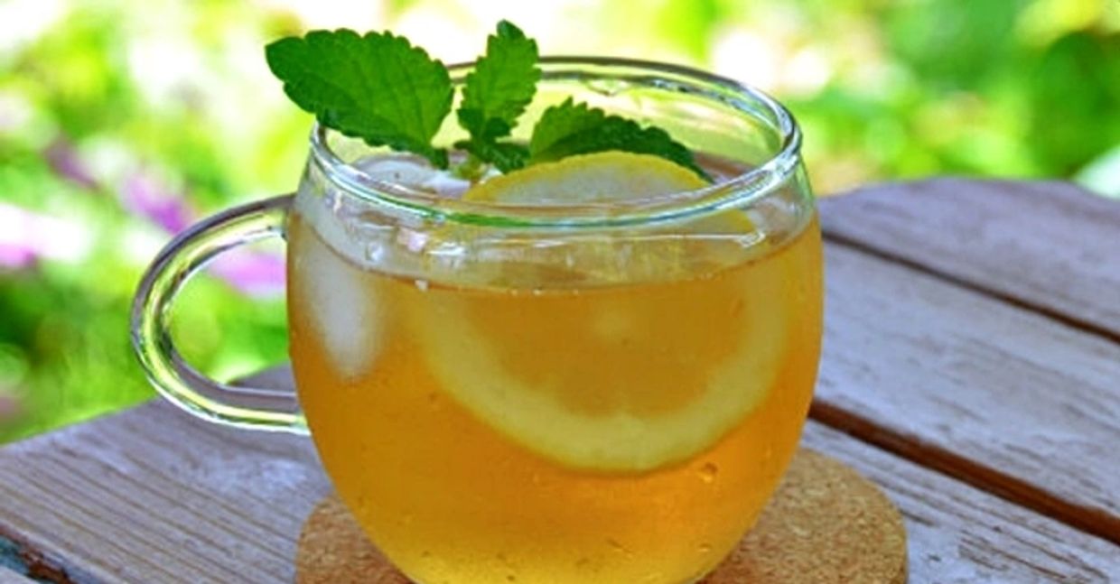 An image of a cup of Lemon Balm brewed with hot water, a dietary antiviral tea that is widely used.