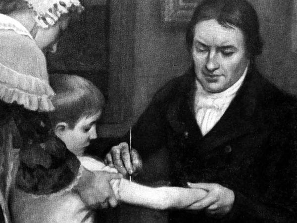 Image of Edward Jenner, inventor of the modern vaccine, administering a dose of cowpox to young boy.