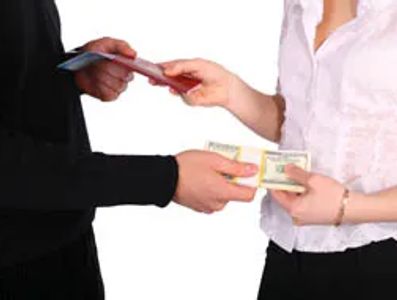 Picture of couple exchanging alimony payment.