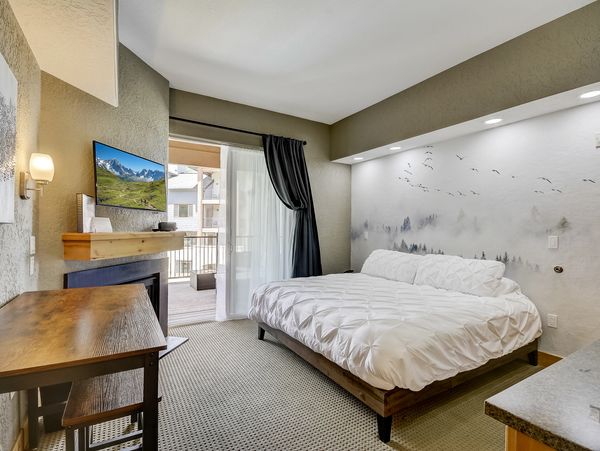 King Hotel Room with private deck under the mountains.