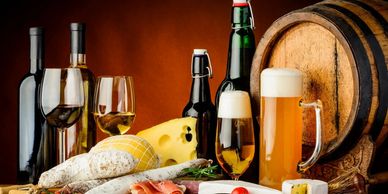 Variety of wines, beer, and cheese with charcuterie.