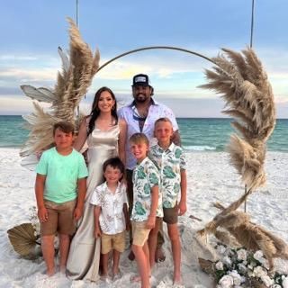 Patrick w/his wife Macey and their four sons