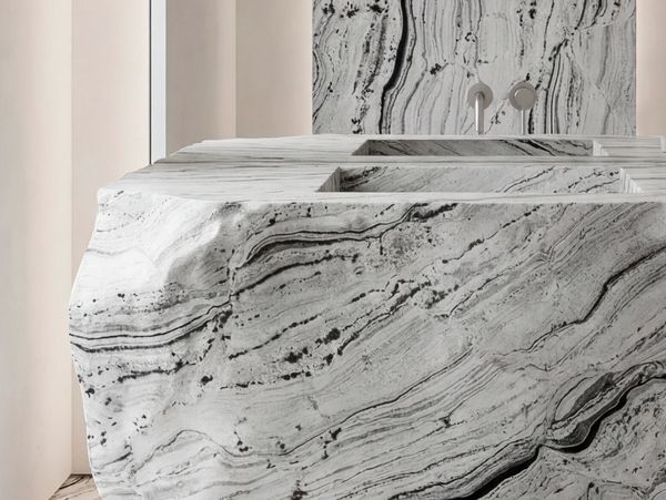 Modern bathroom sink made of black and white marble.