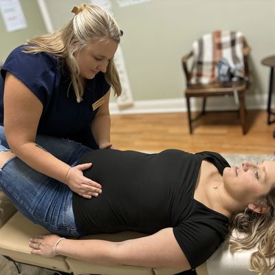 Pregnant woman receiving a prenatal check-up.