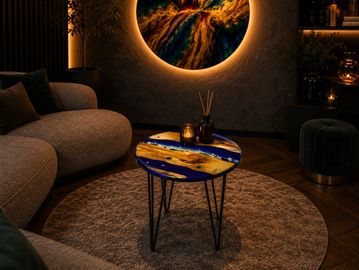 Cozy living room with artistic resin river coffee table and glowing wall art.