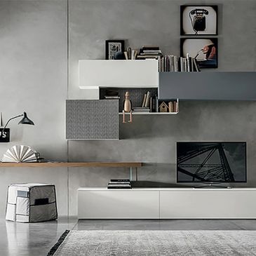 Modern minimalist living room with geometric shelves and a sleek TV setup.