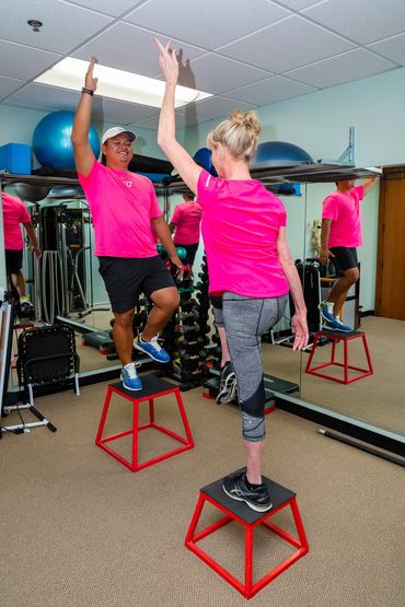 A woman training how to do exercise