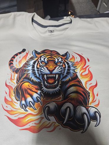Fierce tiger graphic on a white shirt.