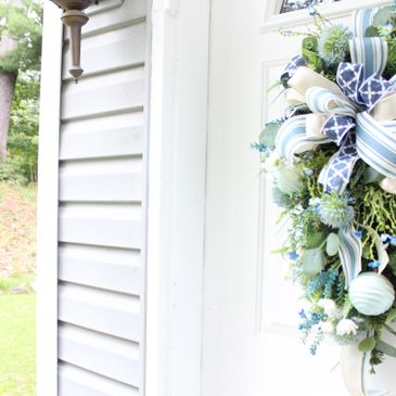 Blue wreath swag hanging on door