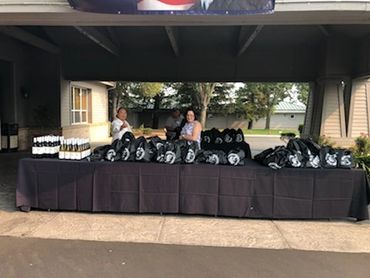 Bottles of wine and goodie bags await the golfers