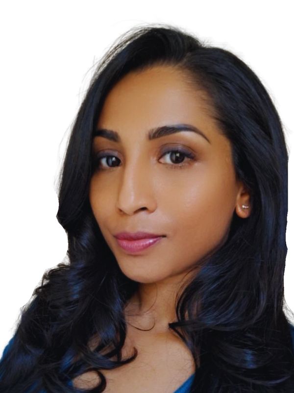 Close-up portrait of a woman with long black hair and natural makeup.