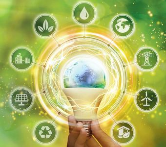 Hand holding a glowing light bulb with environmental icons.