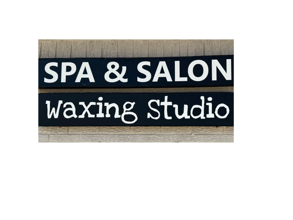 Sign for a spa and salon waxing studio.
