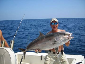 man holding a amberjack