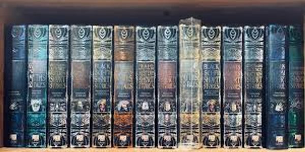 A collection of classic hardcover books with dark, worn spines.