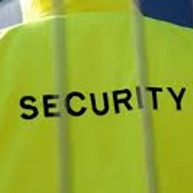 Yellow security jacket with 'SECURITY' printed.