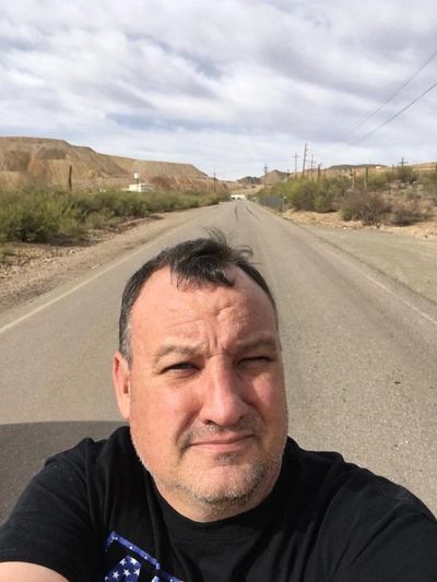 Edward Chadburn's selfie with the road to our old town site behind him.