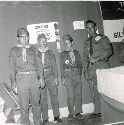 Frank Sanchez, Steve Jameson and Alan Reiner stand with Herb Cleaver, their Scout leader.